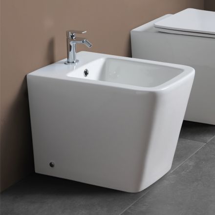 Bideu cu o singură gaură, montat pe podea, din ceramică albă, cu un design modern și elegant - Giunco Viadurini