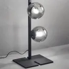 Lampă de podea modernă din metal negru sau auriu și sticlă suflată - Birga Viadurini