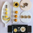 Placă rotundă de brânză în marmură albă sau neagră, fabricată în Italia - Kirby Viadurini