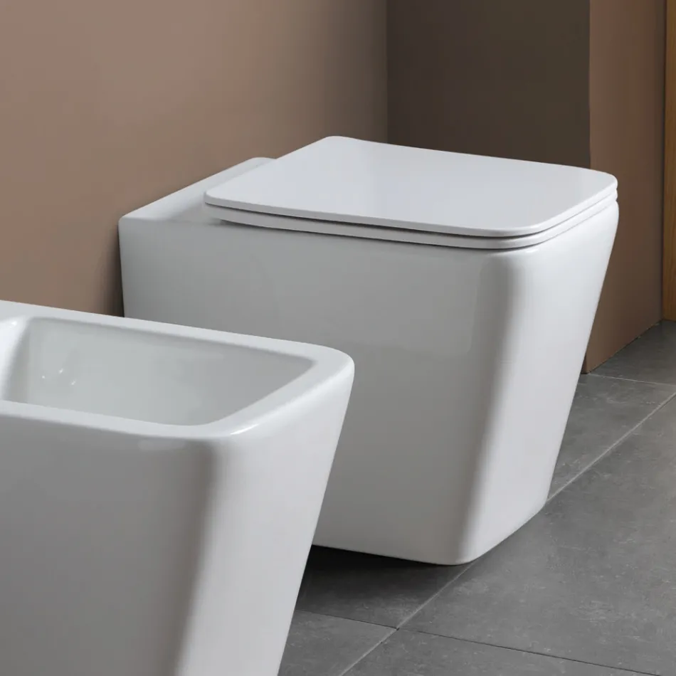 Toaletă montată pe podea cu capac ceramic cu închidere silențioasă și design modern - Giunco Viadurini