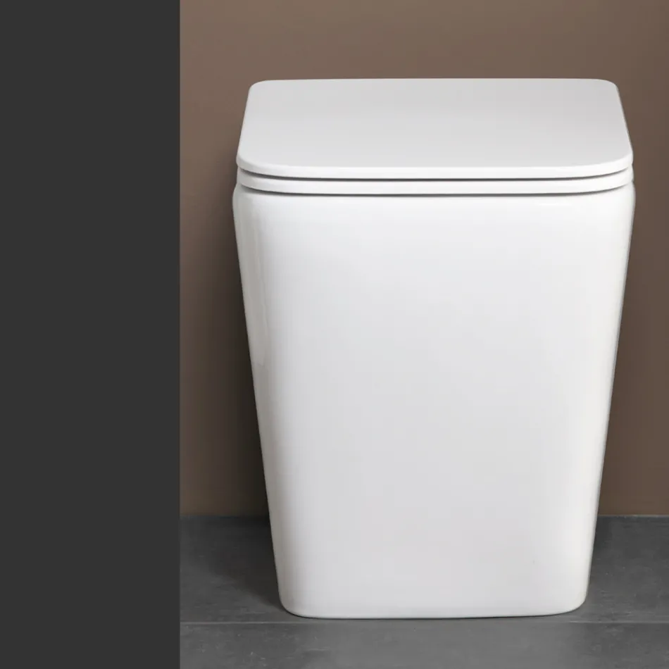 Toaletă montată pe podea cu capac ceramic cu închidere silențioasă și design modern - Giunco Viadurini